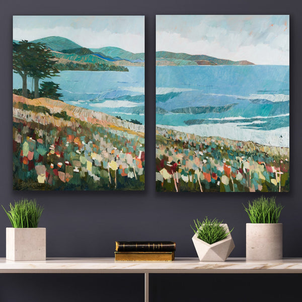 Two landscape paintings on a wall with decorative elements below.