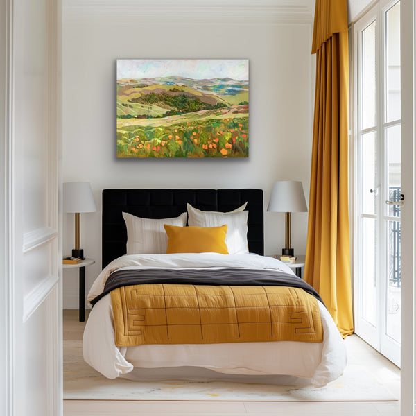 Modern bedroom with yellow bedding, black headboard, and a scenic painting on the wall.