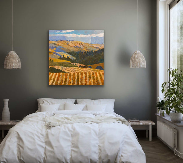 Orange Vineyard painting above a bed