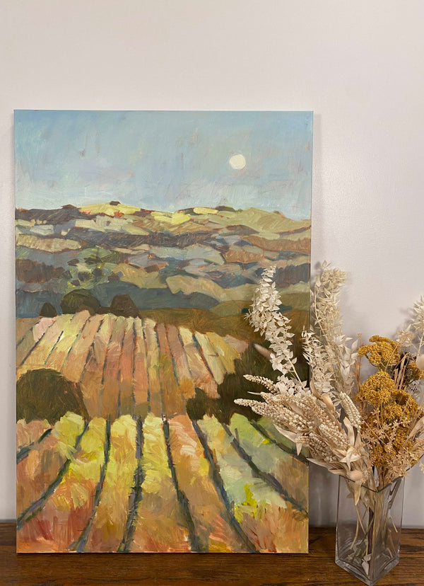 painting of a vineyard with the moon on a table